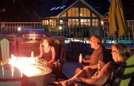 Guests chatting at a firepit.